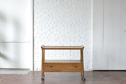 New Inventory available to rent from Paisley and Jade! Mid-century modern wooden bar cart. 