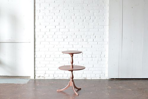 Vintage two tiered table with a beautiful rose gold finish
