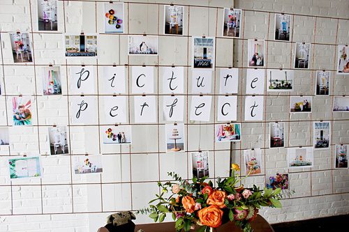 Modern metallic photo display and seating chart by Paisley and Jade