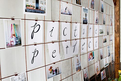 Modern metallic photo display and seating chart by Paisley and Jade