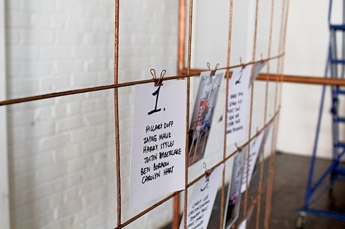 Modern metallic photo display and seating chart by Paisley and Jade