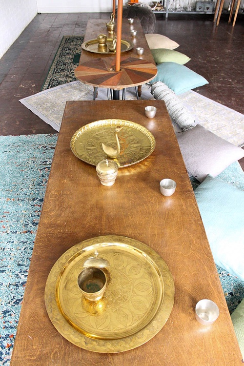 Inspiration station with gorgeous boho-chic low set wooden tables built and styled by Paisley and Jade