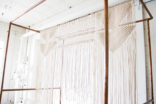 Simple and stunning boho-chic wedding ceremony design featuring copper arbor and other specialty rentals by Paisley and Jade 