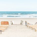 Gorgeous oceanfront beach wedding in Sandbridge Virginia with eclectic and vintage furniture and decor rentals by Paisley and Jade