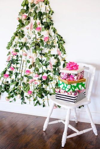 Beautiful winter inspired flowers on chairs moments with specialty and vintage rentals by Paisley & Jade