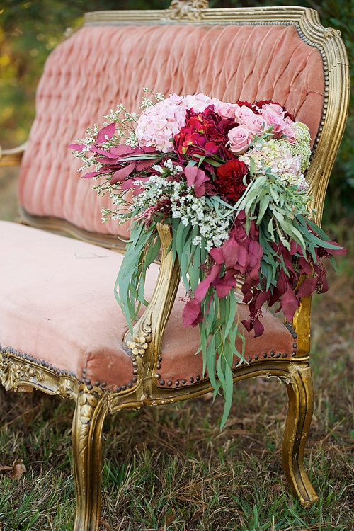 Beautiful winter inspired flowers on chairs moments with specialty and vintage rentals by Paisley & Jade