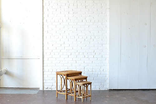 Rattan Nesting Tables available for rent by Paisley & Jade 