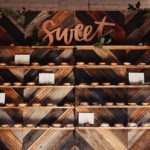 Donut wall created with custom built chevron wooden backdrops available for rent by Paisley and Jade