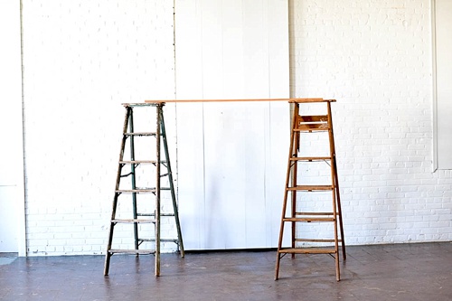 Arbor created with vintage ladders and copper decor pieces available for rent by Paisley and Jade 