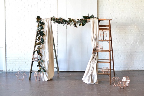 Arbor created with vintage ladders and copper decor pieces available for rent by Paisley and Jade 