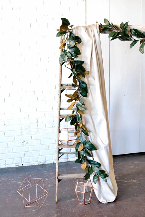 Arbor created with vintage ladders and copper decor pieces available for rent by Paisley and Jade 