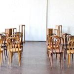 Inspiration Station wedding ceremony design featuring wooden pedestals and chairs available for rent by Paisley and Jade