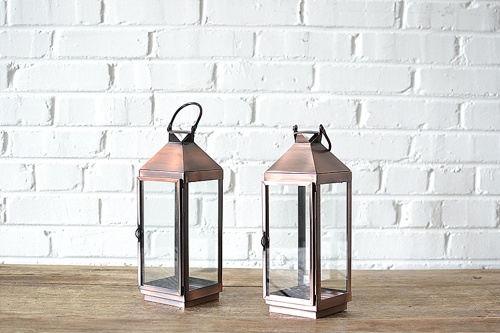 Classic Copper Lanterns available for rent by Paisley & Jade