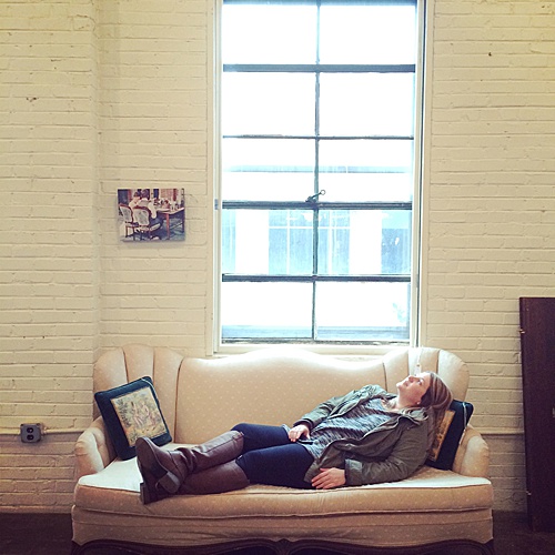 After a weekend full of on-site events, co-captain of Paisley & Jade, Perkins, relaxes on a rentable upholstered couch!