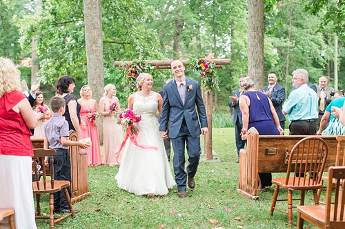 Gorgeous outdoor wedding ceremony on the campus of Hampden-Sydney College in Virginia featuring ceremony seating by Paisley & Jade 