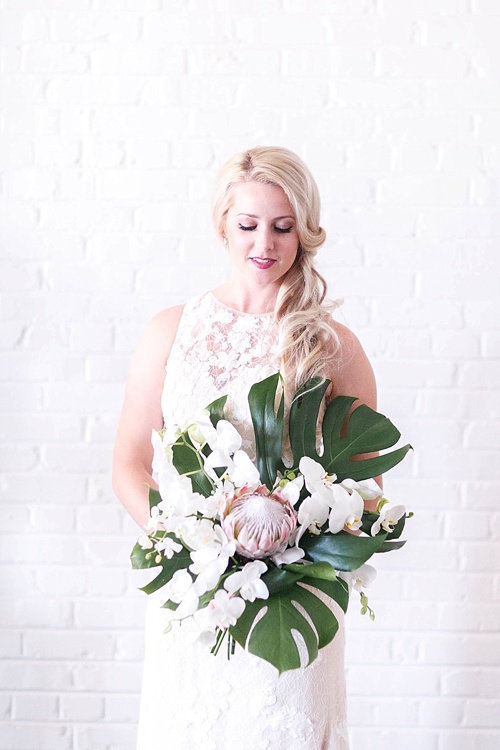 Tropical and white wedding styled shoot and photography workshop with showroom and specialty rentals by Paisley & Jade