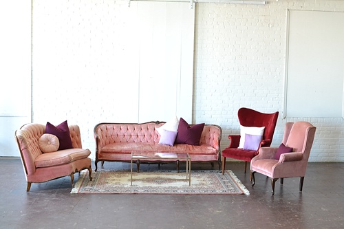 Vintage and eclectic lounge areas styled with monochromatically colored upholstered furniture available for rent for weddings and events by Paisley & Jade 