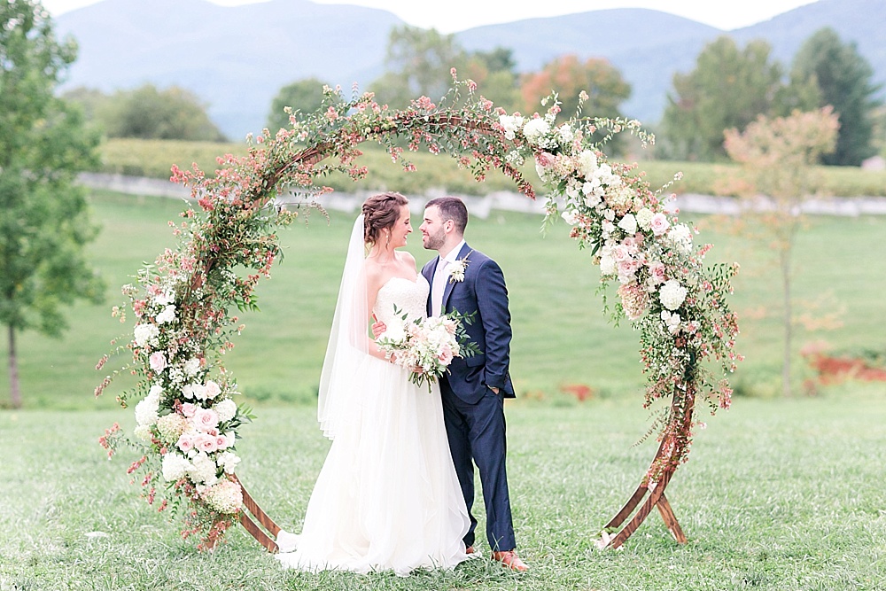 Romantic summer outdoor winery wedding with wooden arbor available for rent by Paisley and Jade