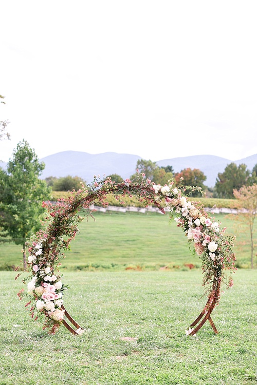 Romantic summer outdoor winery wedding with wooden arbor available for rent by Paisley and Jade