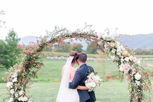 Romantic summer outdoor winery wedding with wooden arbor available for rent by Paisley and Jade