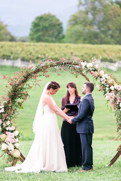 Romantic summer outdoor winery wedding with wooden arbor available for rent by Paisley and Jade