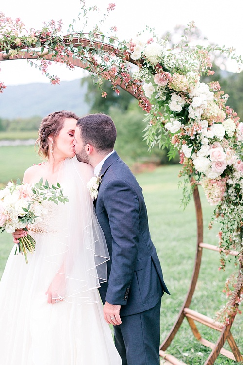 Romantic summer outdoor winery wedding with wooden arbor available for rent by Paisley and Jade