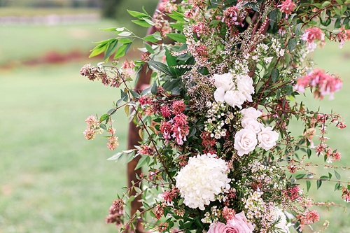 Romantic summer outdoor winery wedding with wooden arbor available for rent by Paisley and Jade