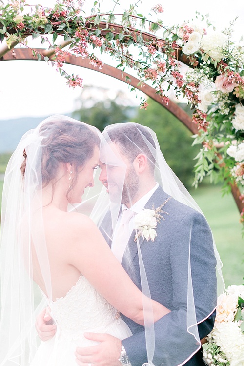 Romantic summer outdoor winery wedding with wooden arbor available for rent by Paisley and Jade