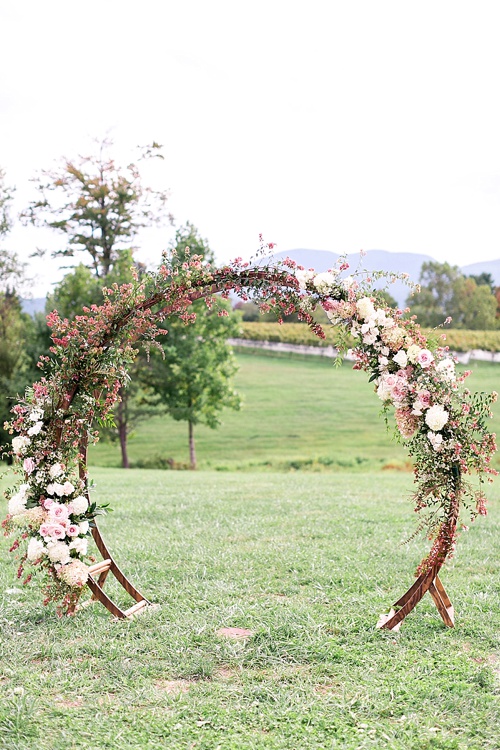 Romantic summer outdoor winery wedding with wooden arbor available for rent by Paisley and Jade