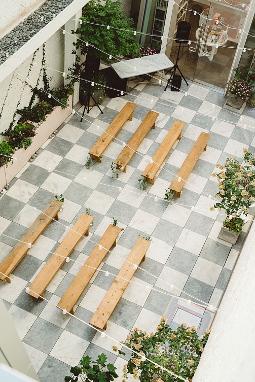 Chic and charming courtyard wedding at Quirk Hotel in Richmond, Virginia with specialty and vintage rentals by Paisley & Jade 