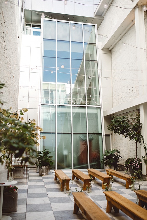 Chic and charming courtyard wedding at Quirk Hotel in Richmond, Virginia with specialty and vintage rentals by Paisley & Jade 