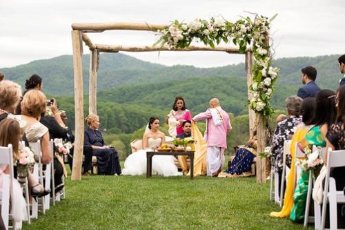 Stunning outdoor ceremony for an Indian wedding at Pippin Hill with specialty and vintage rentals by Paisley & Jade 