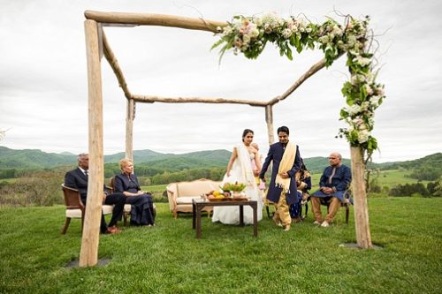 Stunning outdoor ceremony for an Indian wedding at Pippin Hill with specialty and vintage rentals by Paisley & Jade 