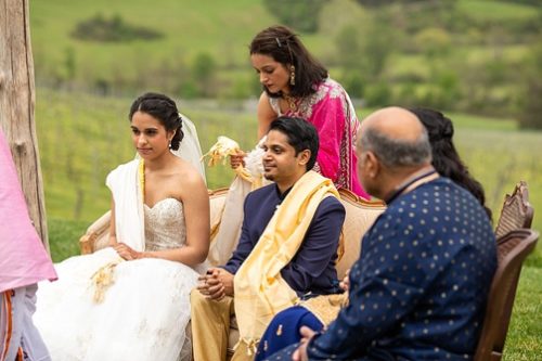 Stunning outdoor ceremony for an Indian wedding at Pippin Hill with specialty and vintage rentals by Paisley & Jade 