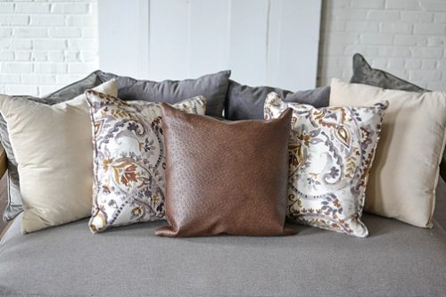 Styling with colorful and chic pillows at Highpoint & Moore with inventory, space and design by Paisley & Jade 