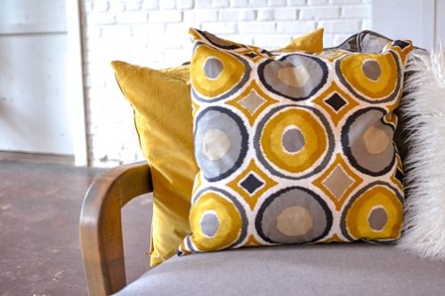 Styling with colorful and chic pillows at Highpoint & Moore with inventory, space and design by Paisley & Jade 