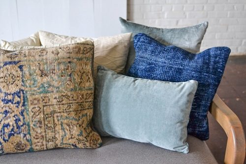 Styling with colorful and chic pillows at Highpoint & Moore with inventory, space and design by Paisley & Jade 