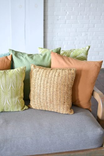 Styling with colorful and chic pillows at Highpoint & Moore with inventory, space and design by Paisley & Jade 