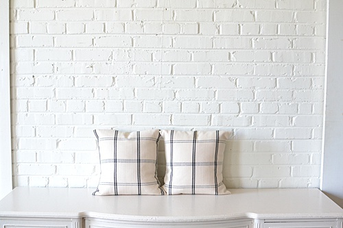 pair of neutral plaid pillows