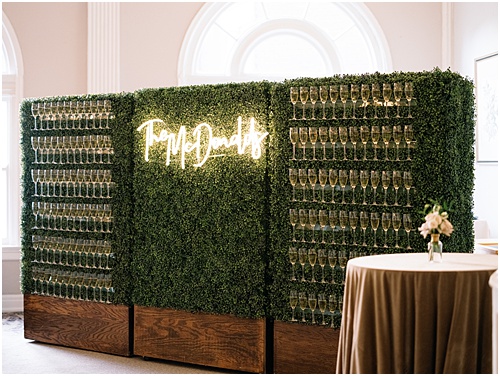 paisley and jade specialty wedding rentals and champagne wall at omni homestead