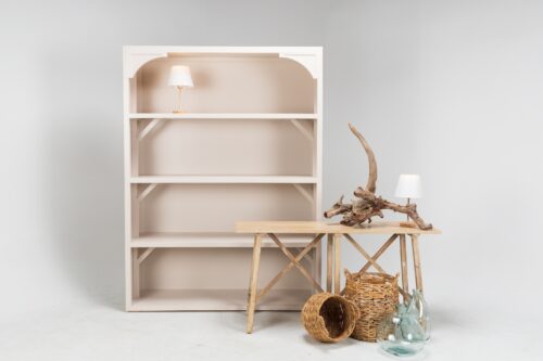 taupe shelving with cordless white and gold lamp, light wood console table, driftwood, seagrass baskets and turquoise vases for a visual display for a product shoot