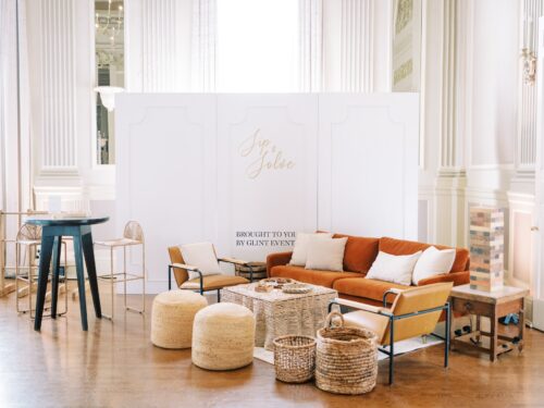 eight foot freestanding walls paired with a lounge of the rexburg sofa and emmet chairs along with the black abbott cocktail table and seagrass barstools for a designed booth expo