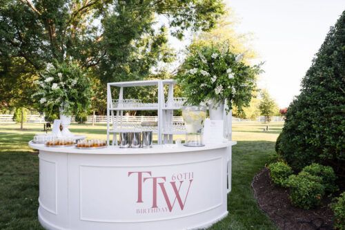 White Estate Round Bar with White Shelf Back Bar for a social event or wedding that's outdoors.