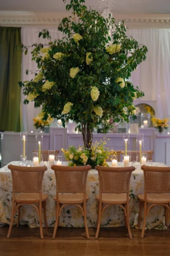 willamette chairs paired with large scale centerpieces and floral linens