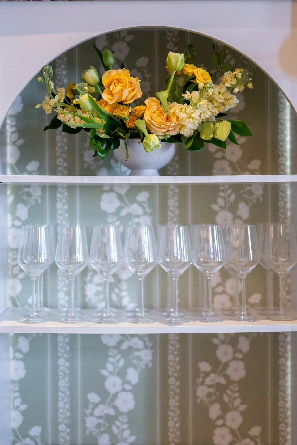 inset arch display wall with shelves